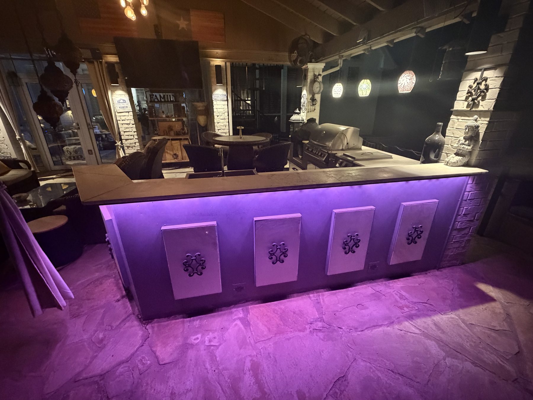 Outdoor kitchen bar with purple underglow lighting