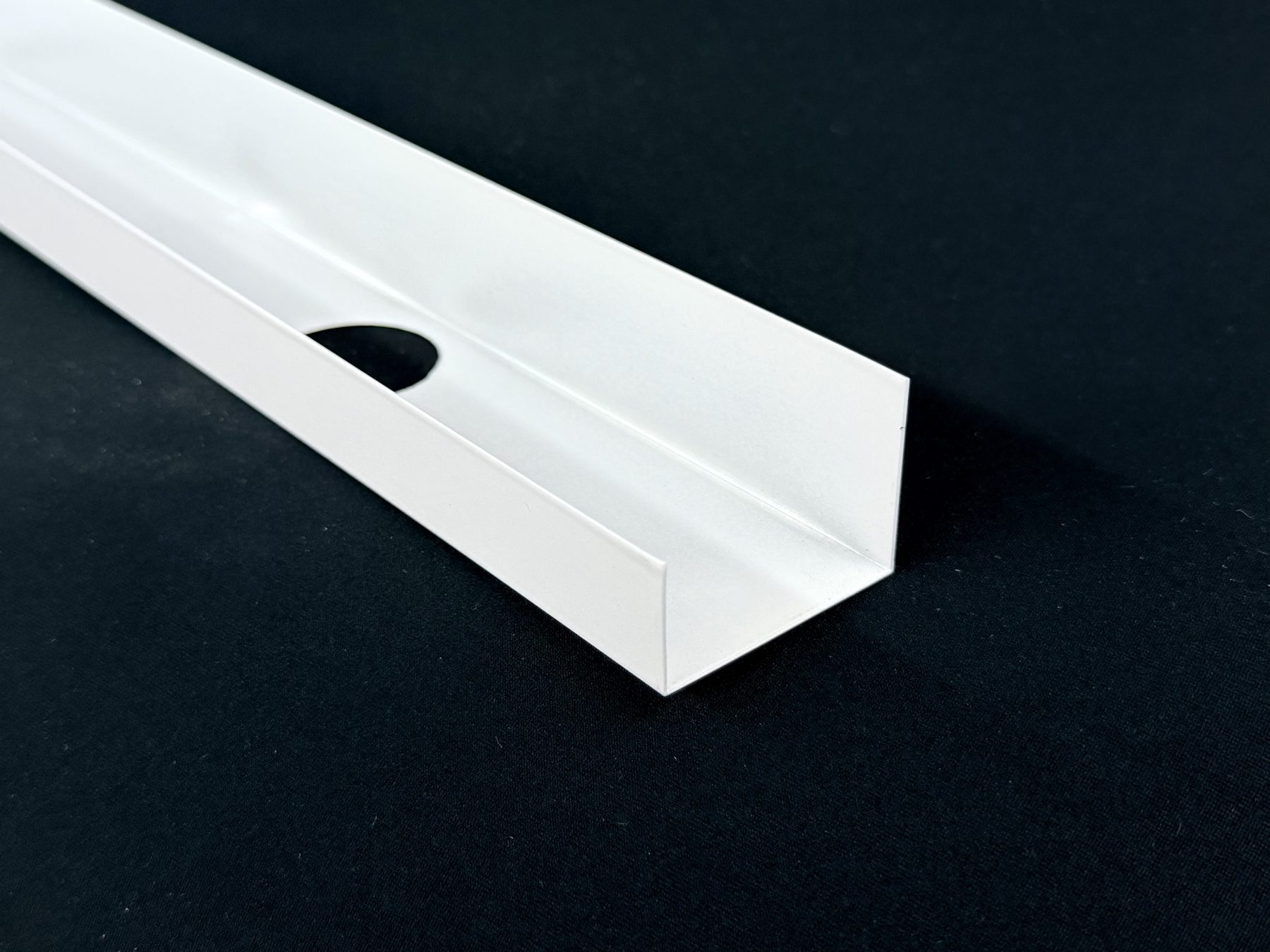 White powder-coated aluminum U-track for fascia-mounted permanent lighting